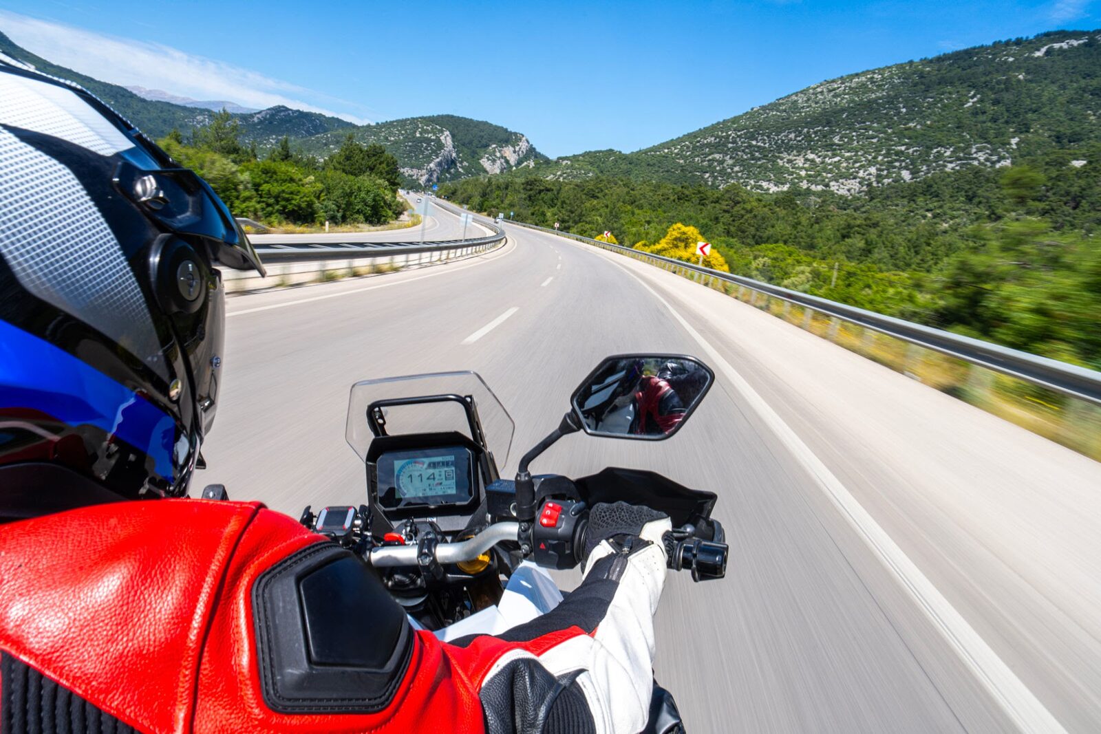A motorcyclist's point of view carving down a mountain highway insurance — InsureToday24, insuretoday24.com